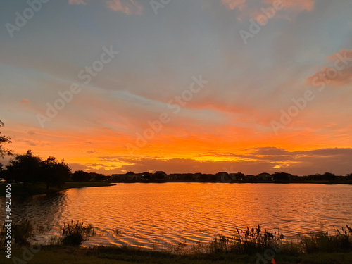 Beautiful pink  orange and blue sunset reflecting on a lake