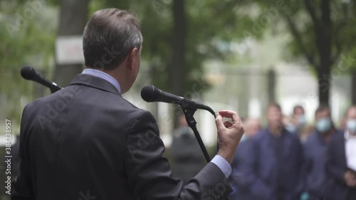 The politician agitates voters before elections. Meeting outdoor