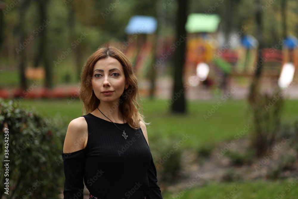 Portrait of beautiful woman in the park Portrait of beautiful woman in the park