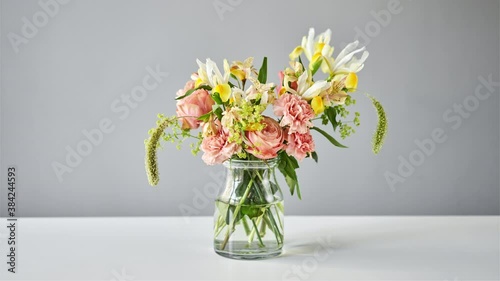 Stop motion. Bouquet 005, step by step installation of flowers in a vase. Flowers bunch, set for home. Fresh cut flowers for decoration home. European floral shop. Delivery fresh cut flower.
