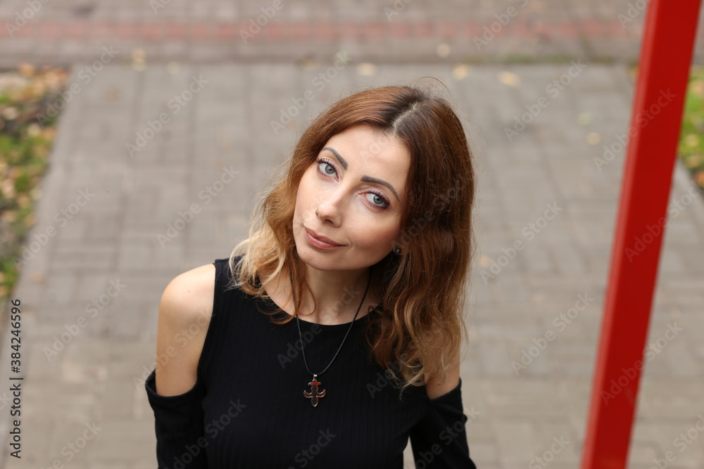 Fototapeta premium Portrait of beautiful woman in the park