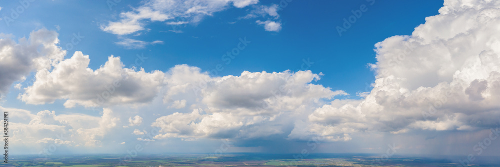 White clouds on a background of blue sky. Panorama White clouds on a background of blue sky. Panorama