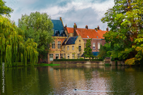 Bruges, Flanders, Belgium, Europe - October 1, 2019. Neo-Gothic medieval castle on the shore of lake of love in autumn Bruges (Brugge)