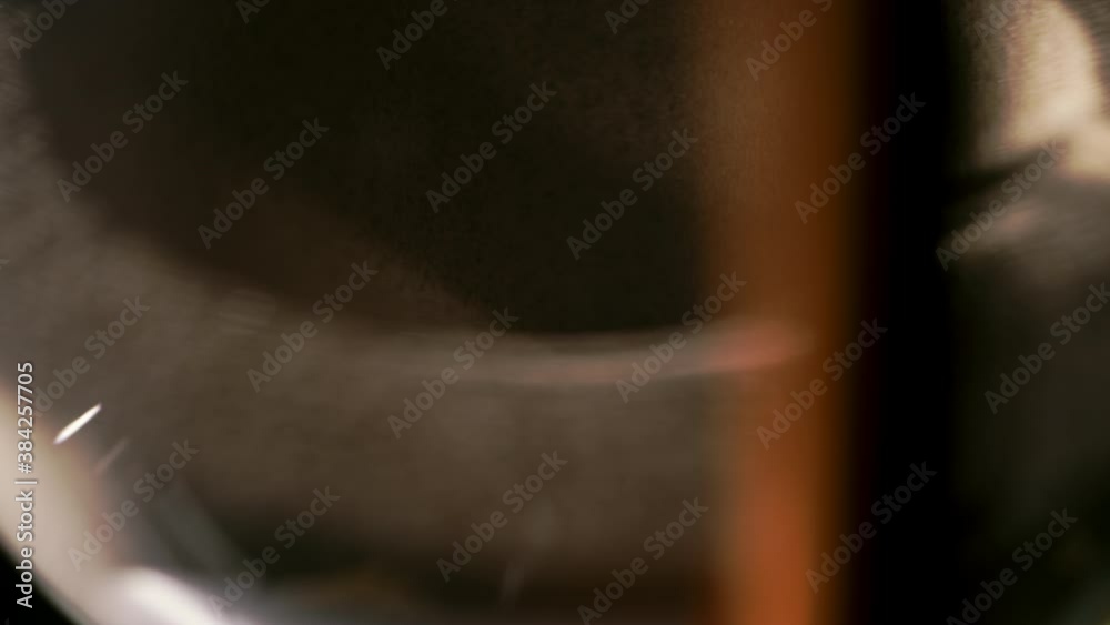 Detail stop motion of sand falling through an hourglass Detail stop motion of sand falling through an hourglass