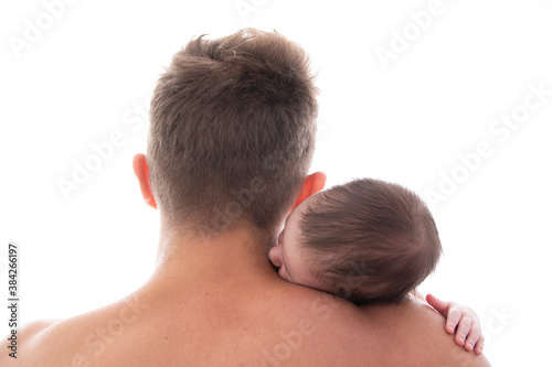  baby sleeps in his father's arms