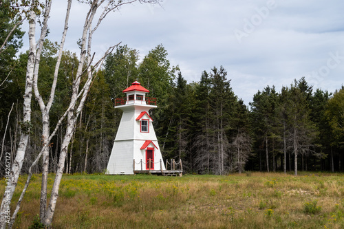 View of the Pointe-Duthie lighthouse in New Richmond, Canada photo