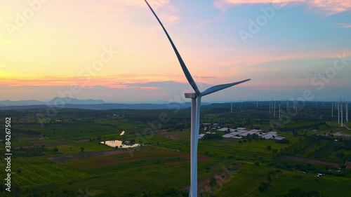 ariel shot wind farm turbine in evening