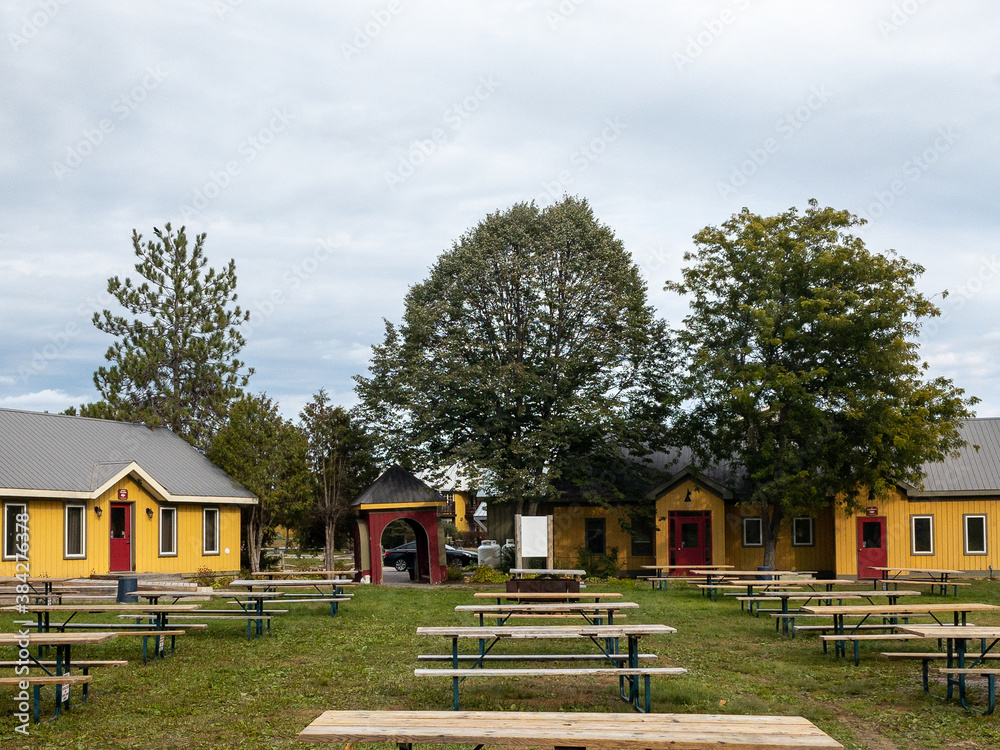 picnic tables and interesting small buildings with autumn tree colors