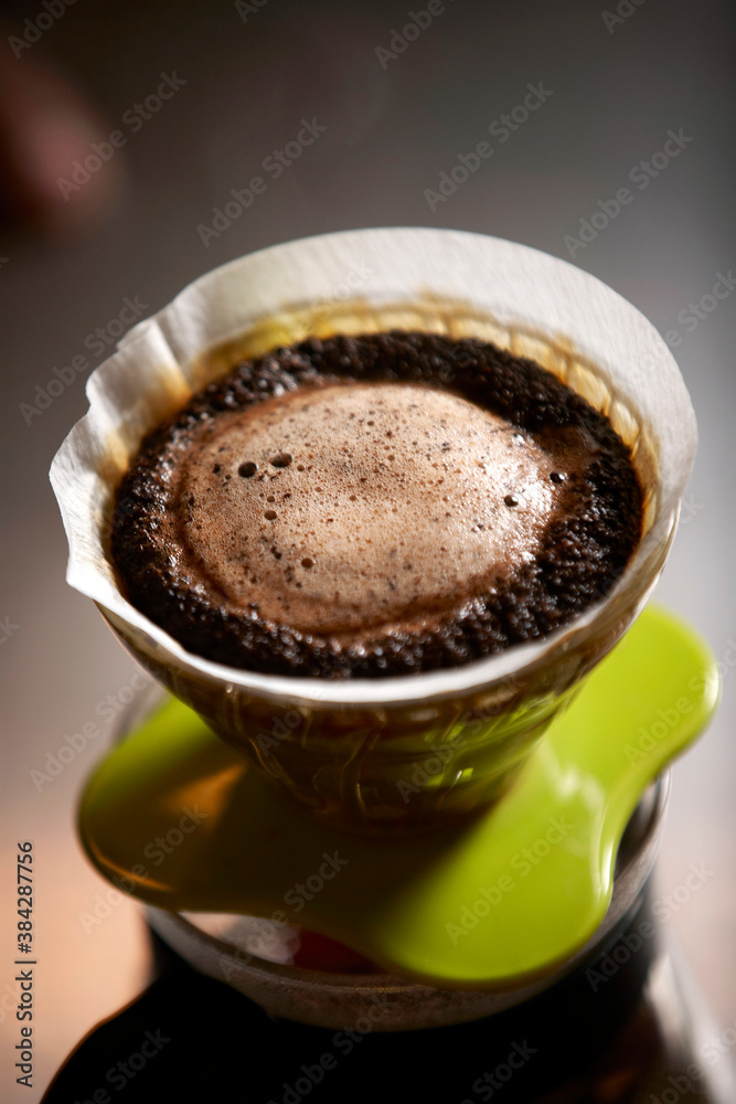 pouring coffee into a cup pouring coffee into a cup