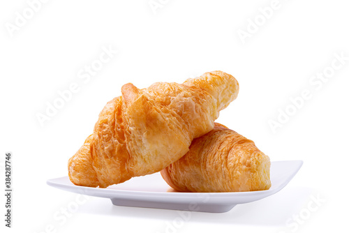Croissant on white plate isolated over white background with clipping path. Croissant french breakfast.