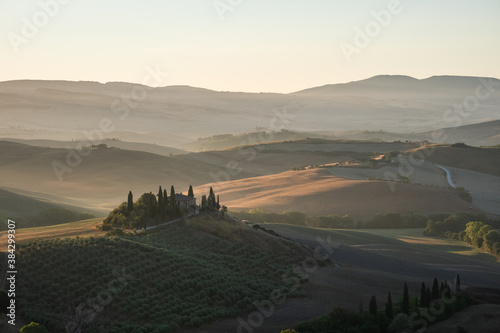 Podere Belvedere Villa in Val d'Orcia Region in Tuscany, Italy at Sunrise or Dawn near San Quirico on a Summer Morning