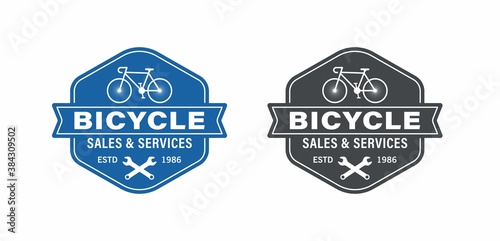 Set of color illustrations of bicycle, wrenches, vintage ribbon and text on a white background. Vector illustration for logos, emblems, labels. Bicycle sales shop, repairs and services.