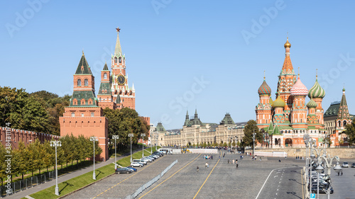 above view of Vasilevsky Descent of Red Square and Kremlin Tower and Vasily the Blessed Cathedral in Moscow city from Bolshoy Moskvoretsky Bridge on sunny autumn day