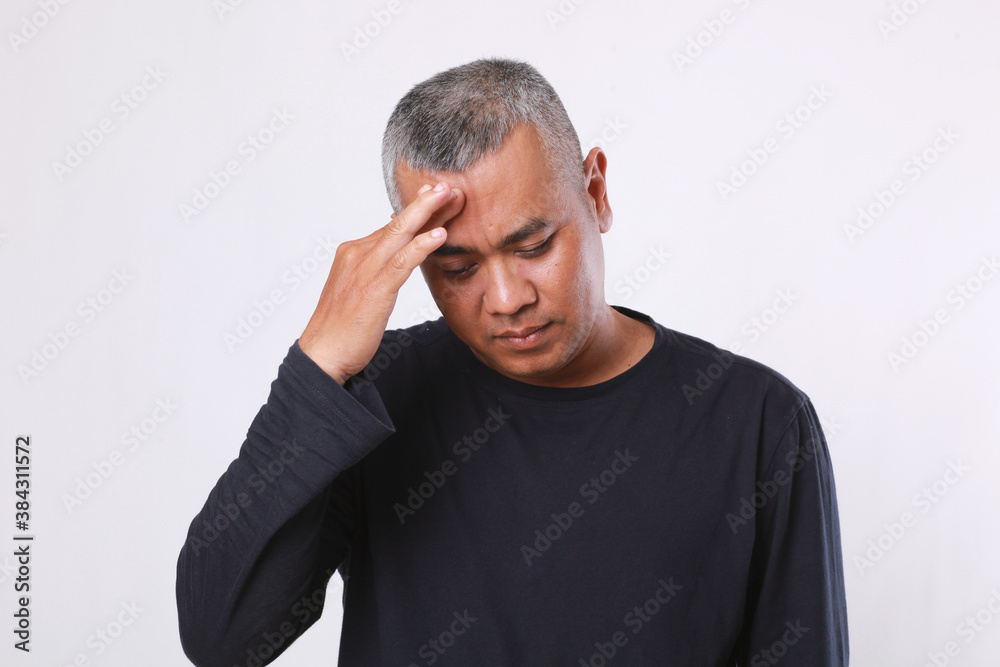 Man having a headache expression isolated on white Man having a headache expression isolated on white