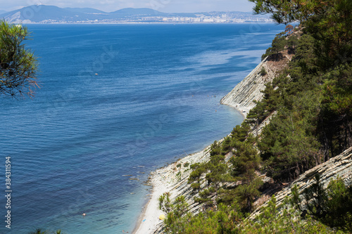 Beautiful summer landscape. Hiking in the picturesque places. View of the sea, wild beach and the neighboring city of Novorossiysk. Surroundings of the resort of Gelendzhik. Russia, Black sea coast