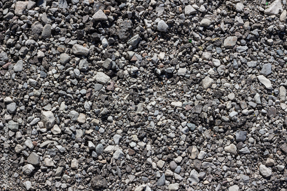 The texture of a country stone road. Background The texture of a country stone road. Background