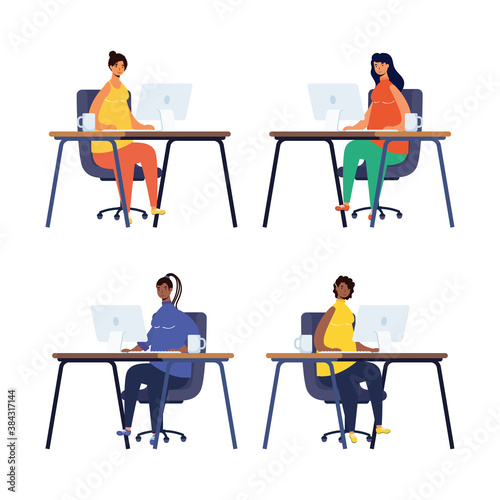 group of women working in computers desktops in the workplace