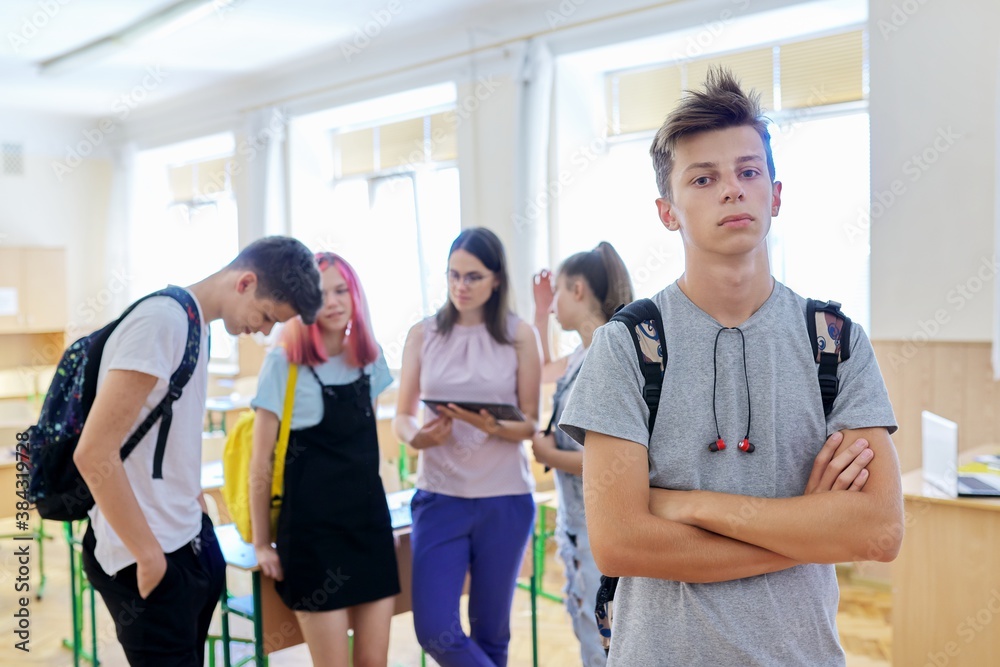 Portrait of smiling teenage boy in class on break Portrait of smiling teenage boy in class on break