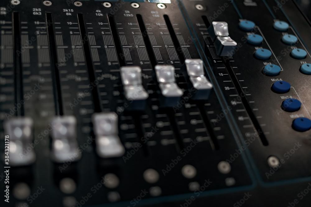 Sound music equalizer mixer control. Musical instruments and equipment, Sound board controller. Professional audio control panel mixing console with buttons, faders and sliders. Selective focus.