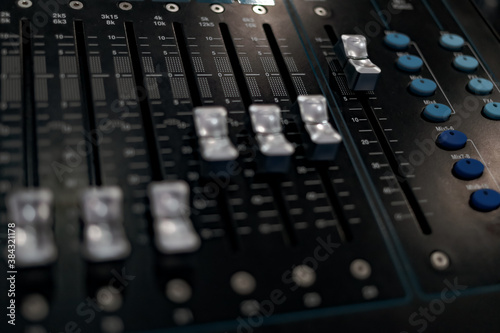 Sound music equalizer mixer control. Musical instruments and equipment, Sound board controller. Professional audio control panel mixing console with buttons, faders and sliders. Selective focus.