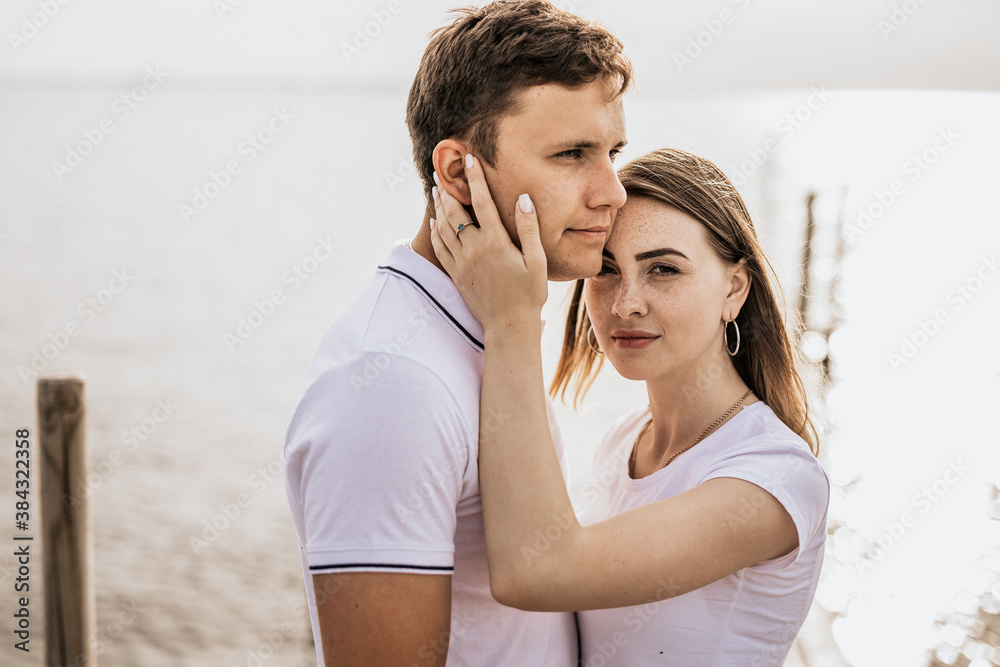 Close up of romantic couple enjoying sunset harbor view Close up of romantic couple enjoying sunset harbor view