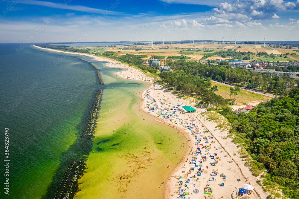 Fototapeta premium Crowded beach with people on Baltic Sea, Darlowko