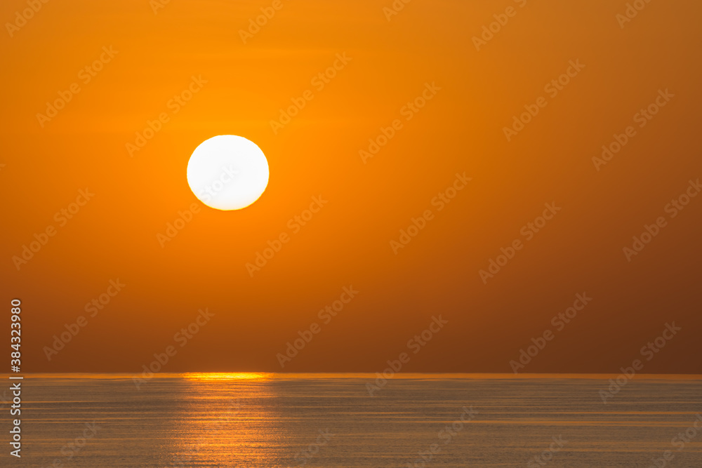 sunrise with small waves on the sea