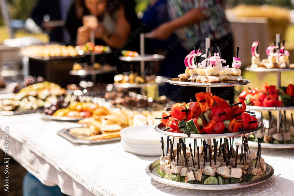 A set of canapes and snack at a banquet with white table A set of canapes and snack at a banquet with white table