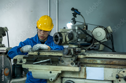 Factory worker are working on projects at machine for steel structure industry.