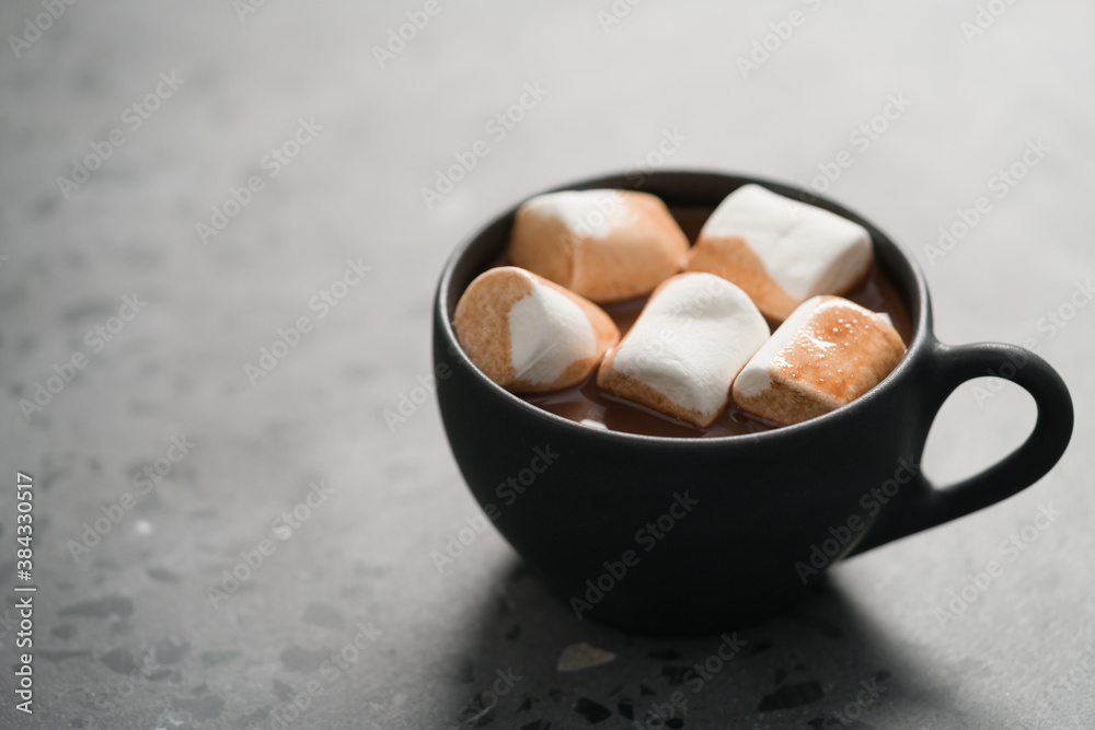 cup of hot chocolate with marshmallow on terrazzo background cup of hot chocolate with marshmallow on terrazzo background
