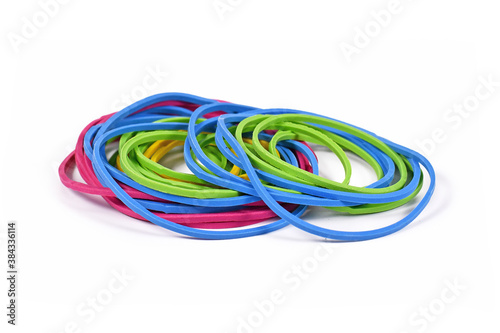 Round household elastic rubber bands in different colors and sizes isolated on white background