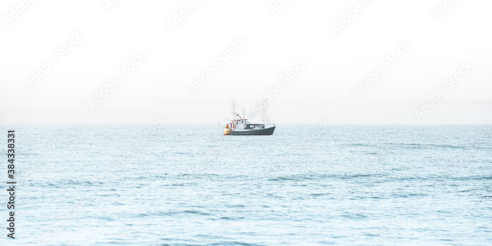 Fishing boat in the middle of the sea