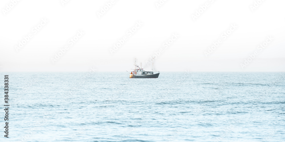Fishing boat in the middle of the sea Fishing boat in the middle of the sea