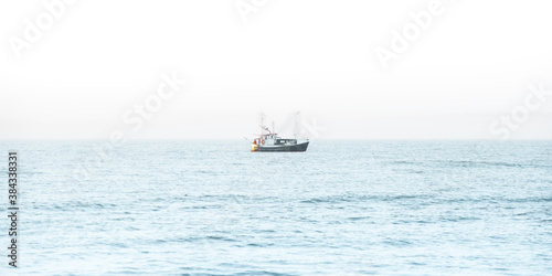 Fishing boat in the middle of the sea