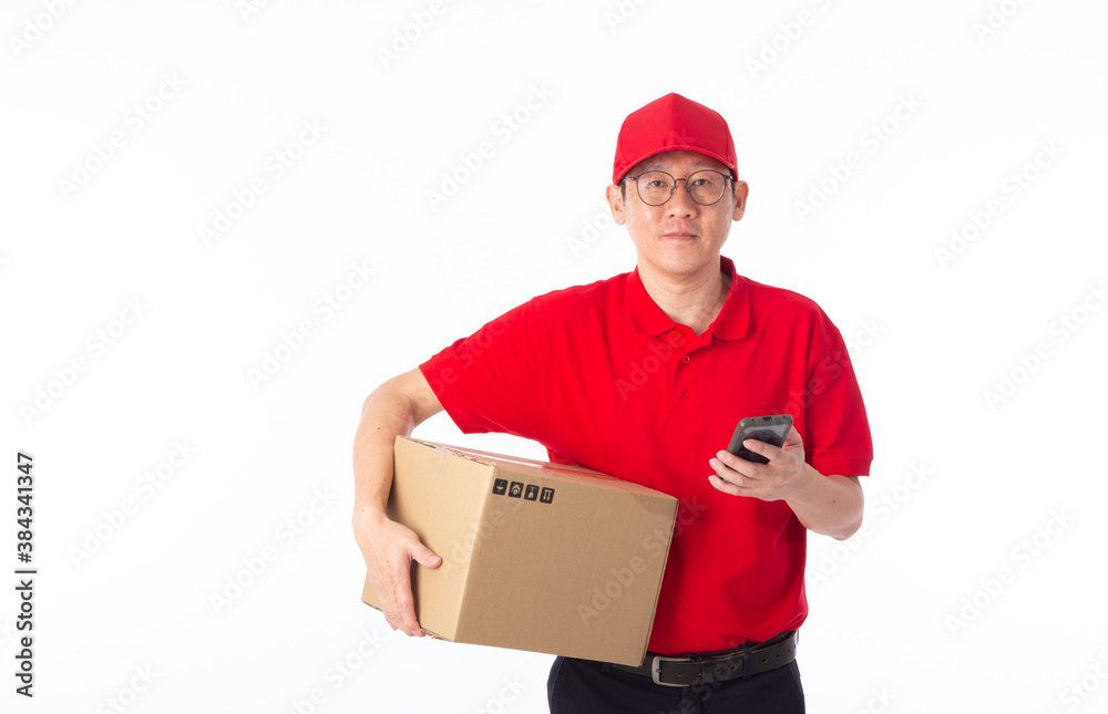 young Asian delivery man in red uniform, carry cardboard box in hands isolated on white background. young Asian delivery man in red uniform, carry cardboard box in hands isolated on white background.