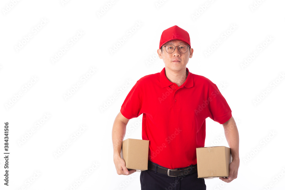 young Asian delivery man in red uniform, carry cardboard box in hands isolated on white background. young Asian delivery man in red uniform, carry cardboard box in hands isolated on white background.