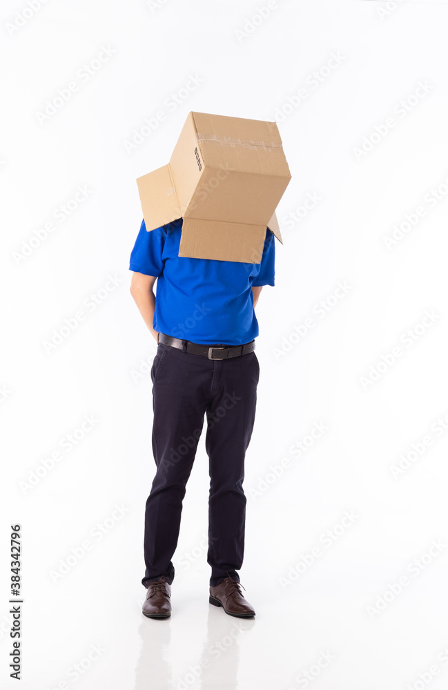 man in a blue T-shirt with a cardboard box on his head makes a gesture with his hands man in a blue T-shirt with a cardboard box on his head makes a gesture with his hands