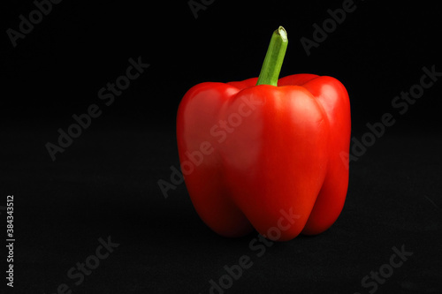 red bell pepper on black background