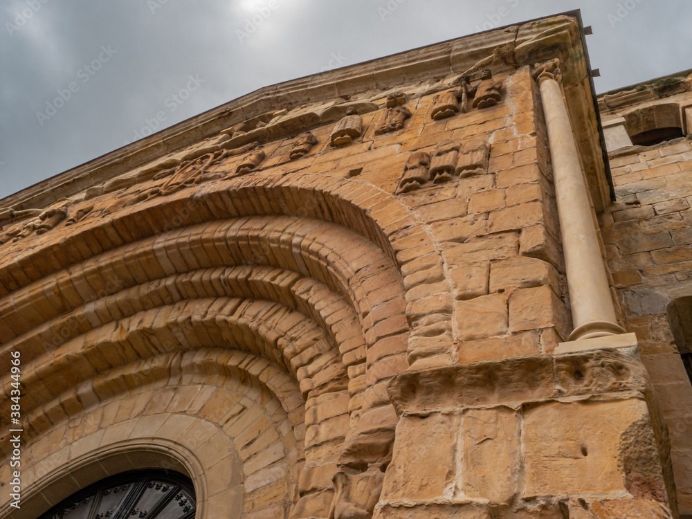 Lower view of the facade of a Romanesque church