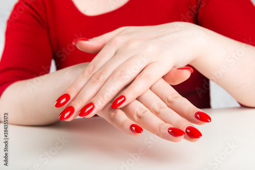 hands with red manicure.