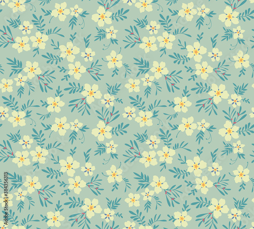 Vintage floral background. Seamless vector pattern for design and fashion prints. Flowers pattern with small white flowers on a light blue background. Ditsy style.