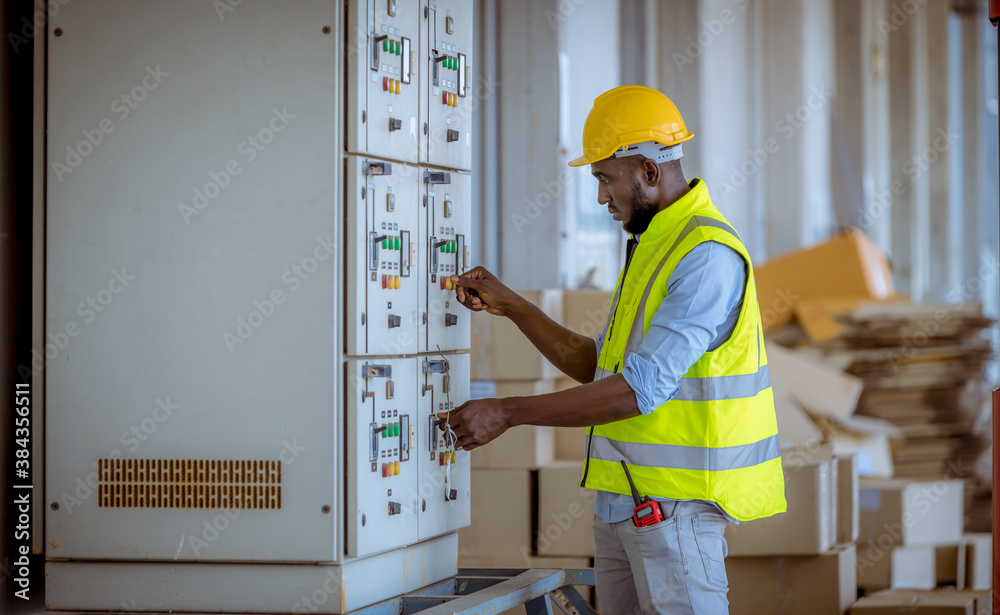 Industry engineer checking and inspecting at MDB panel .he working with electric switchboard to check range of voltage working in Main Distribution Boards factory. Industry engineer checking and inspecting at MDB panel .he working with electric switchboard to check range of voltage working in Main Distribution Boards factory.