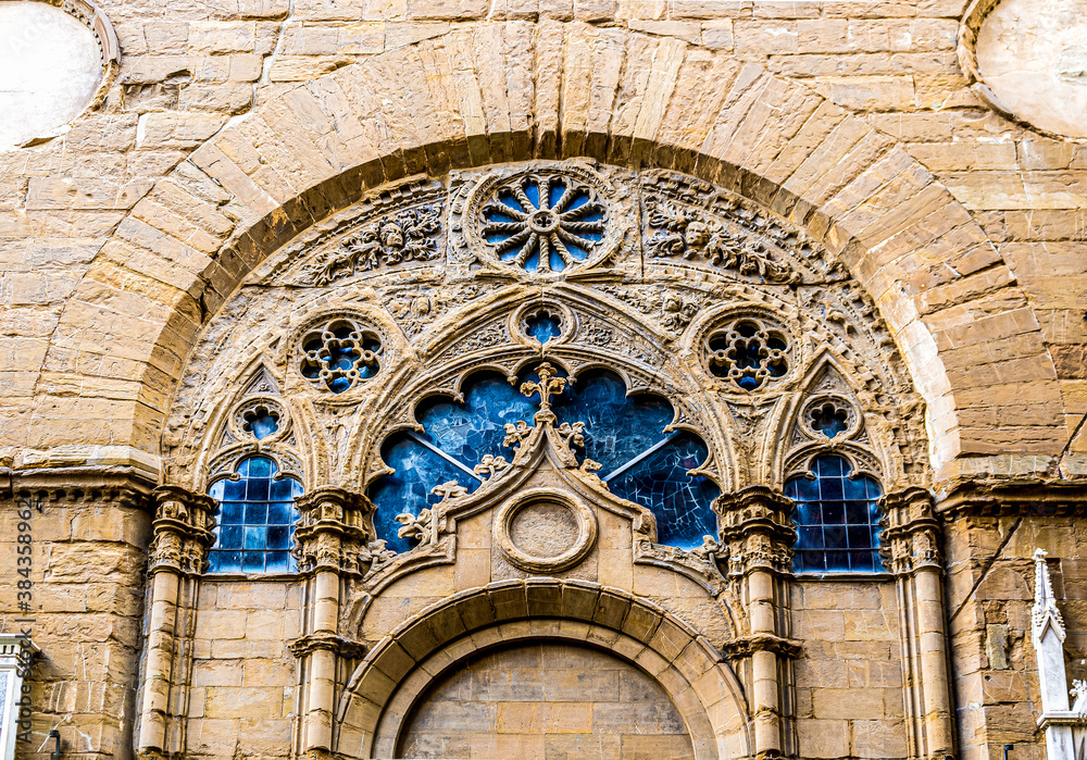 Close up on exterior of the Church of Orsanmichele in via dei Calzaiuoli, built in the 14th century as a grain market and then converted into a church, Florence city center, Tuscany, Italy