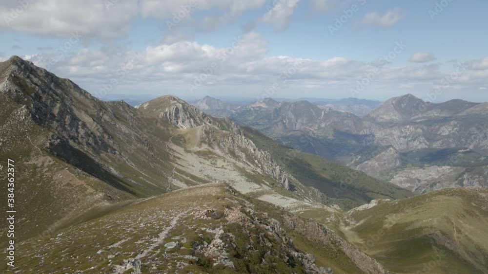 Aerial Mountaintop Ridge back after Reaching the Summit. Hikking route in a Rocky Environment. Healthy lifestyle. Asturias, Spain Aerial Mountaintop Ridge back after Reaching the Summit. Hikking route in a Rocky Environment. Healthy lifestyle. Asturias, Spain