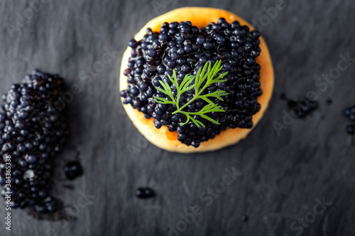 Cracker with black caviar
