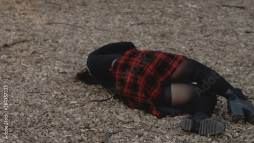 young woman falls to the ground unconscious following the violence suffered