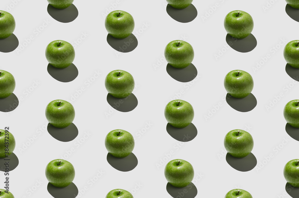 Green apple pattern on a white background. Hard shadows. Green apple pattern on a white background. Hard shadows.