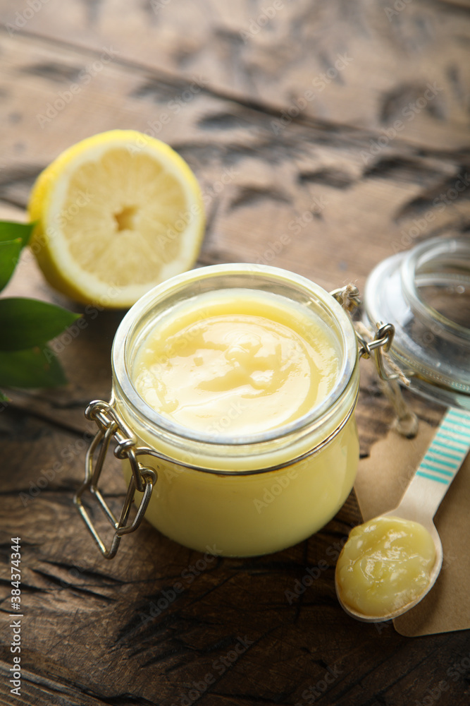 Traditional homemade lemon curd in a jar Traditional homemade lemon curd in a jar