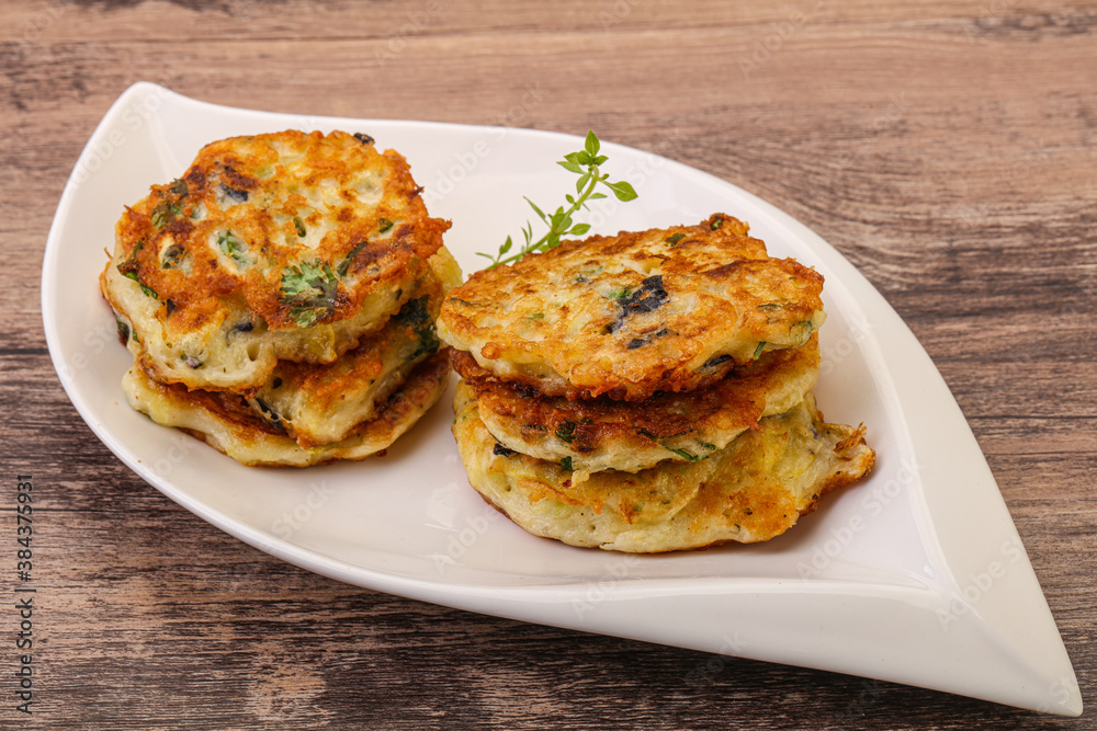 Zucchini pancakes with herbs and spices Zucchini pancakes with herbs and spices
