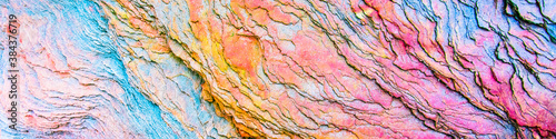 Colourful sedimentary rocks formed by the accumulation of sediments – natural rock layers backgrounds, patterns and textures - abstract graphic design – geology – nature formations